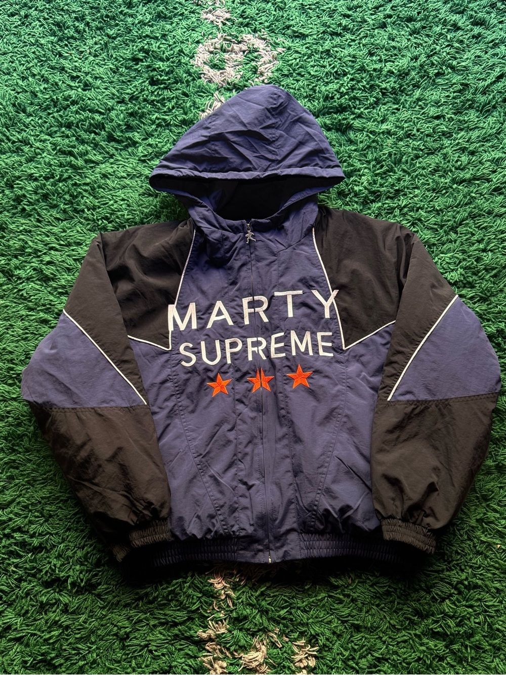 Marty Supreme Navy & Black Hooded Bomber Jacket with Red Stars